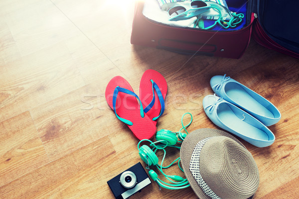 close up of travel bag with clothes and stuff Stock photo © dolgachov