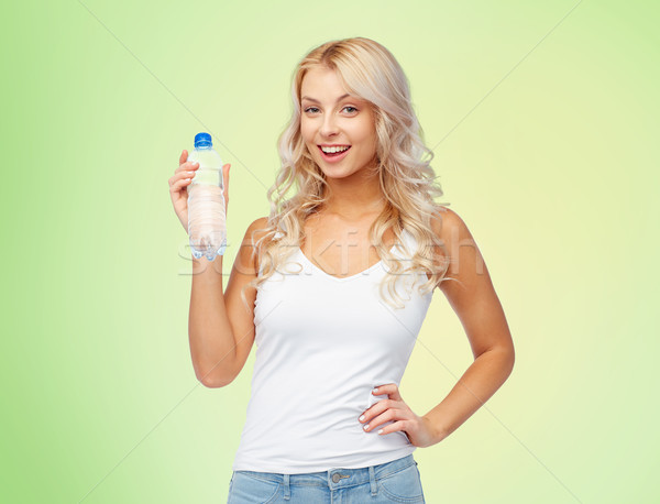 happy beautiful young woman with bottle of water Stock photo © dolgachov