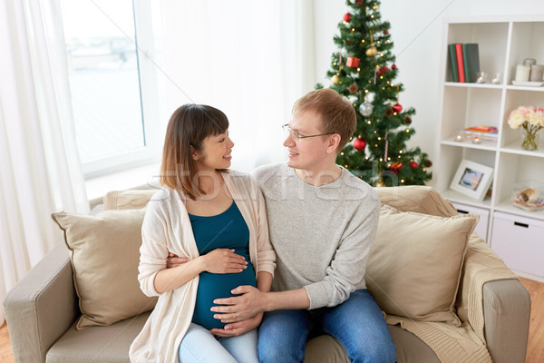 pregnant wife with husband at home at christmas Stock photo © dolgachov