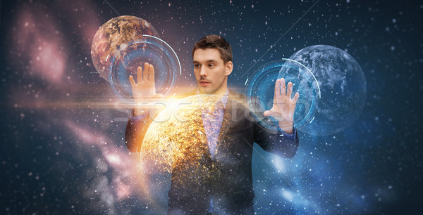 Stock photo: businessman with virtual planets and space