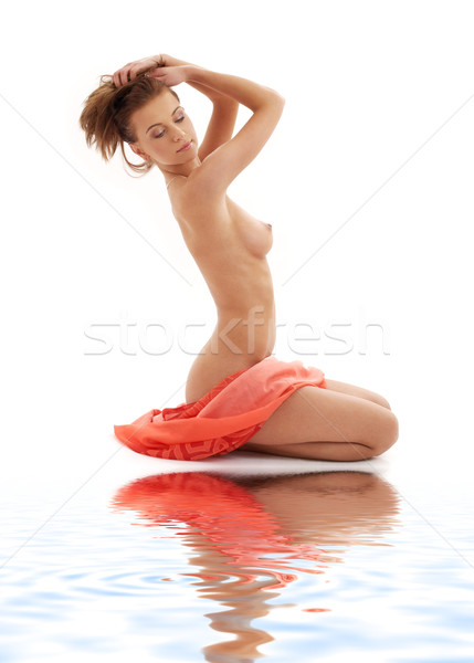 naked girl with red sarong on white sand Stock photo © dolgachov