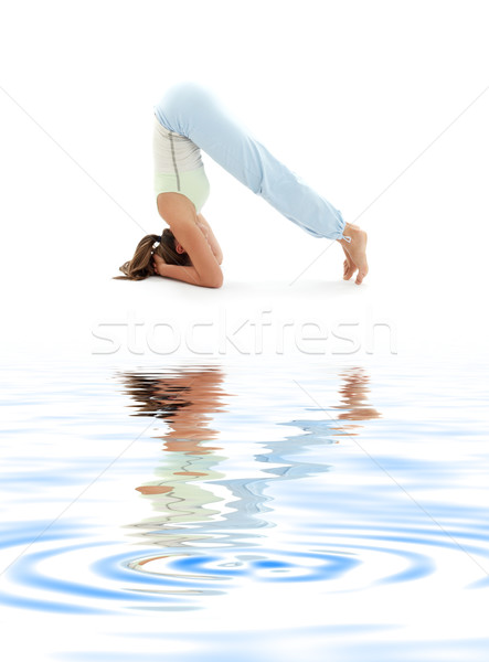 salamba sirsasana supported headstand on white sand #4 Stock photo © dolgachov