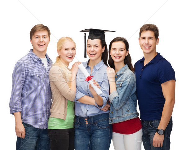 group of standing smiling students with diploma Stock photo © dolgachov
