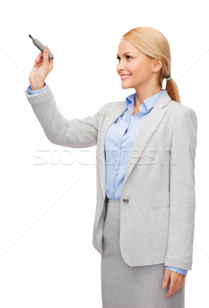 Stock photo: businesswoman writing something in air with marker