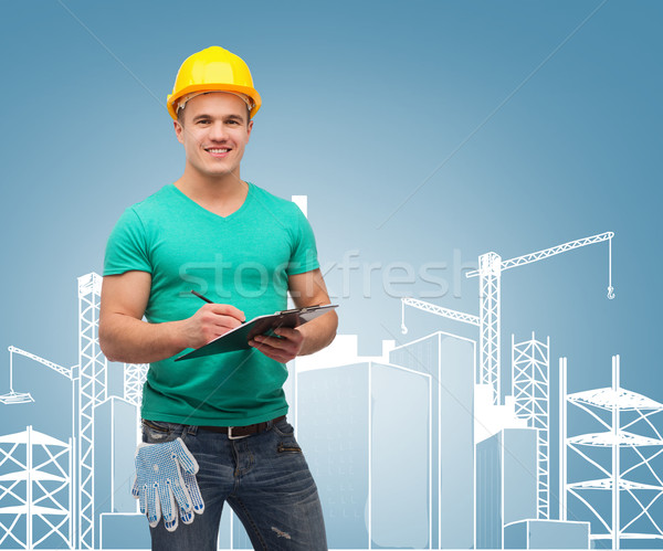 Glimlachend man helm reparatie bouw Stockfoto © dolgachov