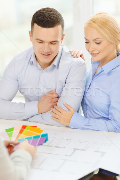 Stock photo: couple looking at blueprint and color samples