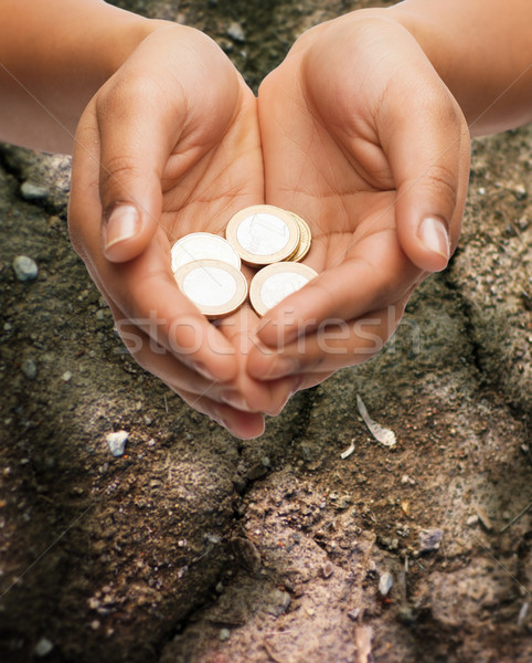 Női kezek tart Euro érmék föld Stock fotó © dolgachov