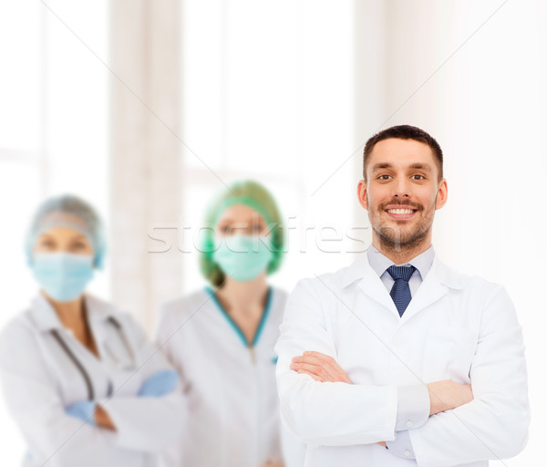 Sonriendo doctor de sexo masculino blanco abrigo salud profesión Foto stock © dolgachov