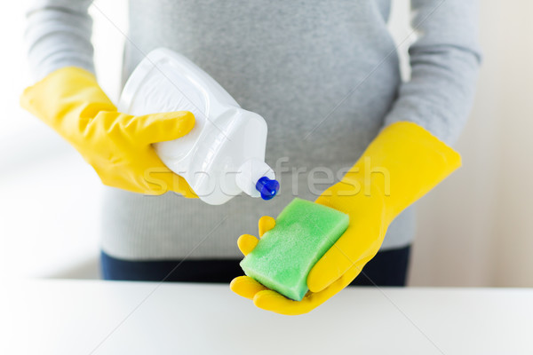 close up of woman with sponge and cleanser Stock photo © dolgachov