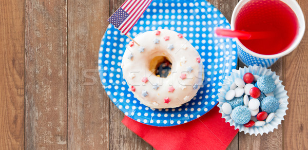 donut with juice and candies on independence day Stock photo © dolgachov