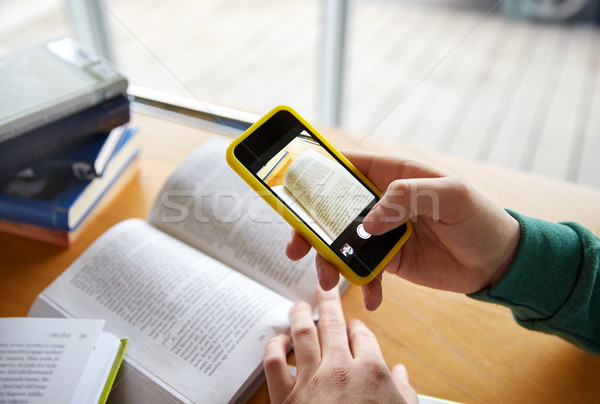 student hands with smartphone making cheat sheet Stock photo © dolgachov