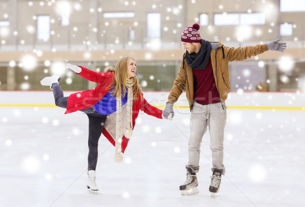 Boldog pár kéz a kézben korcsolyázás pálya emberek Stock fotó © dolgachov