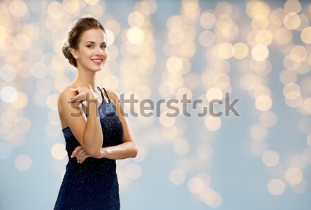 Güzel seksi kadın kırmızı elbise ışıklar insanlar tatil Stok fotoğraf © dolgachov