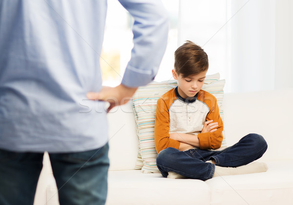 upset or feeling guilty boy and father at home Stock photo © dolgachov