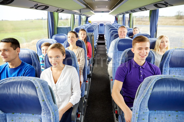 group of happy passengers in travel bus Stock photo © dolgachov