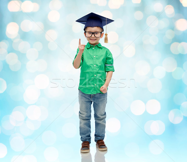 happy boy in bachelor hat and eyeglasses Stock photo © dolgachov