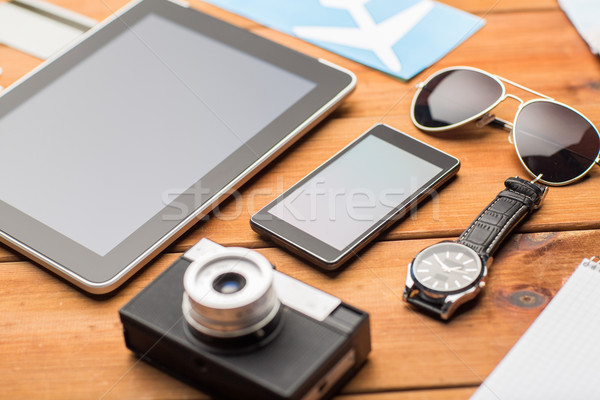 close up of smartphone and travel stuff Stock photo © dolgachov