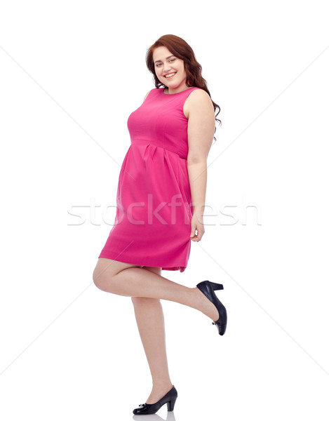 Boldog fiatal plus size nő pózol rózsaszín Stock fotó © dolgachov