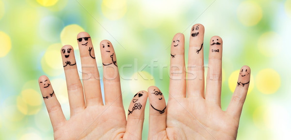 Közelkép kezek ujjak emotikon arcok kézmozdulat Stock fotó © dolgachov