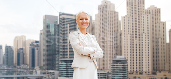 Jeunes souriant femme d'affaires bras gens d'affaires Dubaï [[stock_photo]] © dolgachov