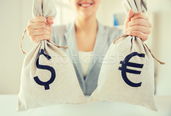 close up of woman hands holding money bags Stock photo © dolgachov