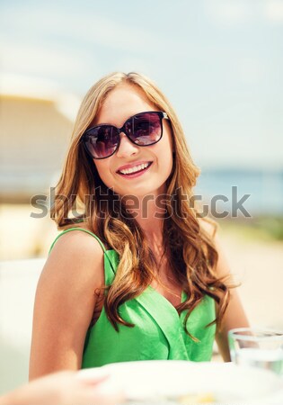 smiling young woman with surfboard on beach Stock photo © dolgachov