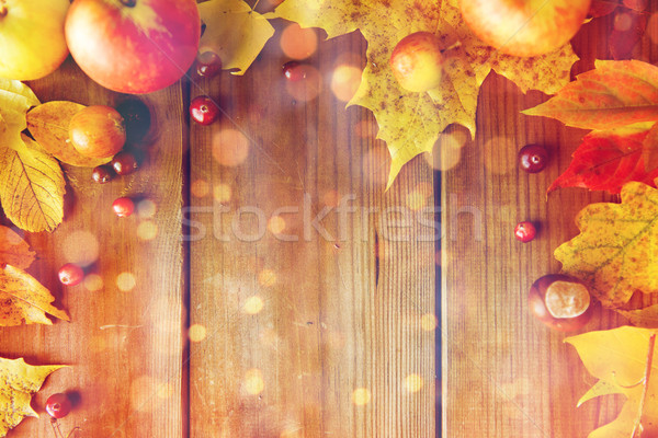 frame of autumn leaves, fruits and berries on wood Stock photo © dolgachov