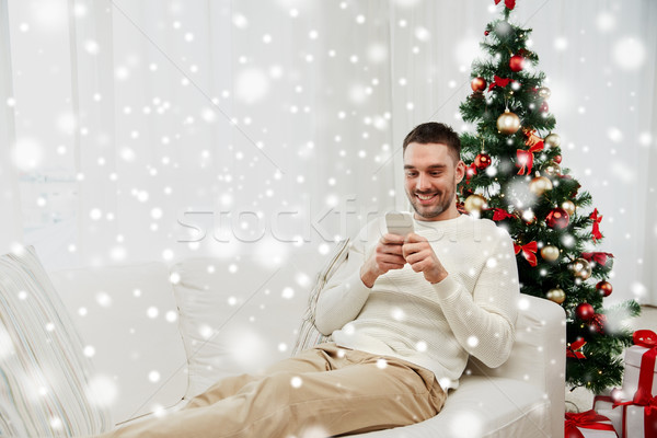 Gülen adam ev Noel teknoloji Stok fotoğraf © dolgachov