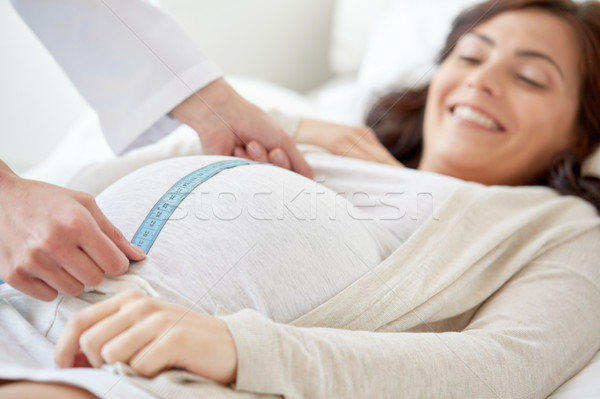 close up of doctor and pregnant woman at hospital Stock photo © dolgachov
