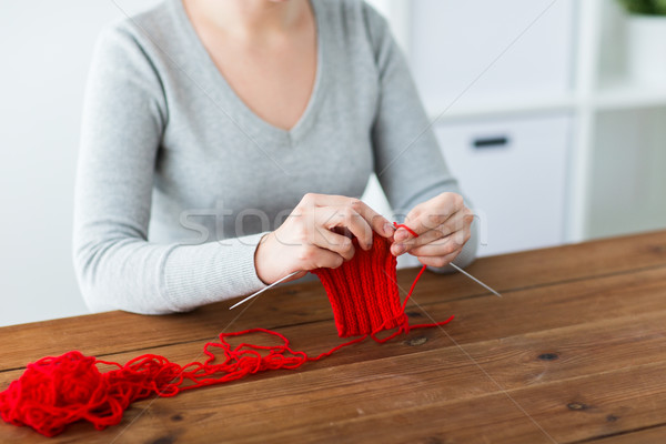 Stock photo: woman hands knitting with needles and yarn