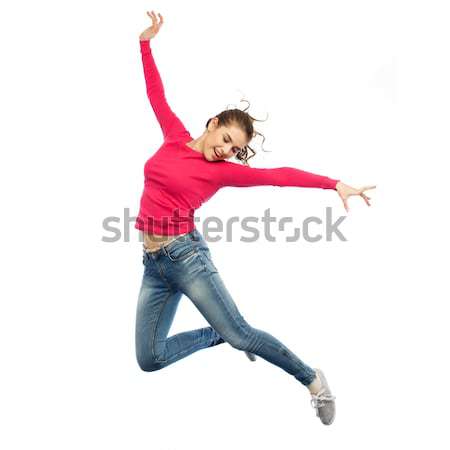 Sorridente mulher jovem saltando ar felicidade liberdade Foto stock © dolgachov