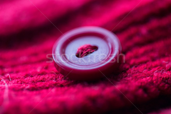 close up of button sewn to knitted item Stock photo © dolgachov