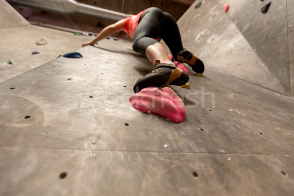 foot of woman exercising at indoor climbing gym Stock photo © dolgachov