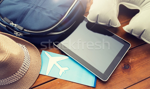 close up of tablet pc and traveler personal stuff Stock photo © dolgachov