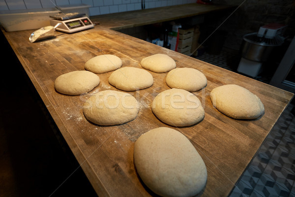 yeast bread dough on bakery kitchen table Stock photo © dolgachov