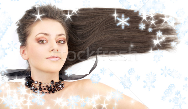 lovely brunette in black collar with snowflakes Stock photo © dolgachov