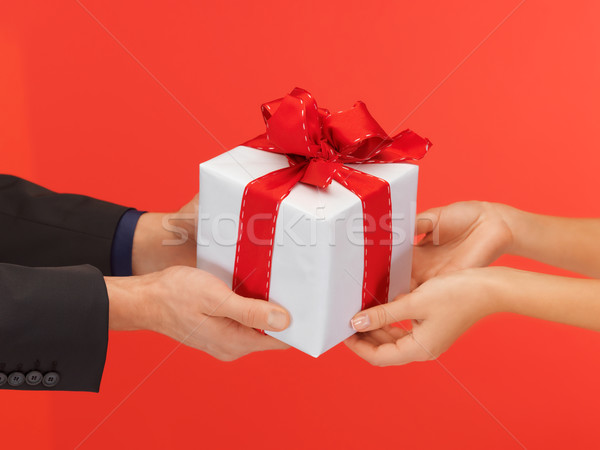 man and woman's hands with gift box Stock photo © dolgachov