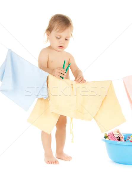 baby doing laundry Stock photo © dolgachov