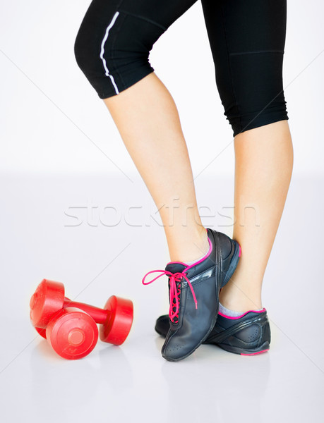 sporty woman legs with light red dumbbells Stock photo © dolgachov