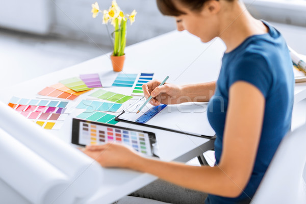 woman working with color samples for selection Stock photo © dolgachov