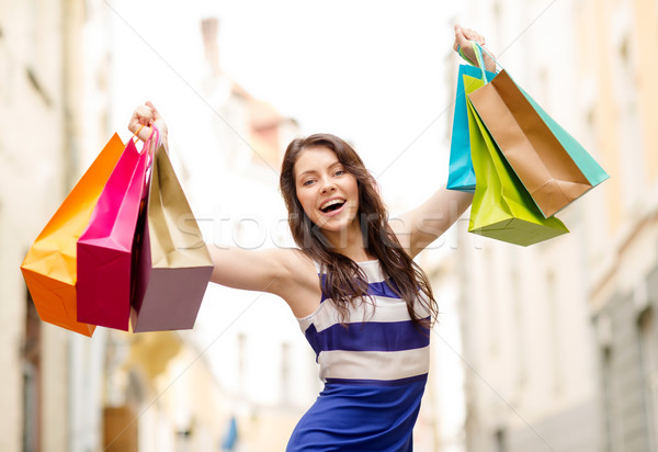 beautiful woman with shopping bags in the ctiy Stock photo © dolgachov