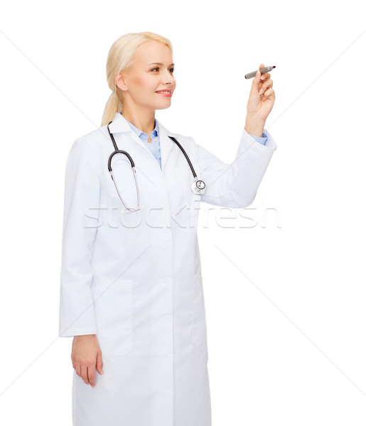 female doctor working with something imaginary Stock photo © dolgachov