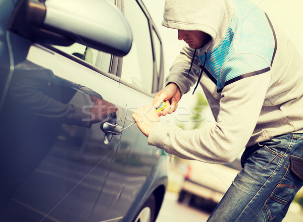 thief breaking the car lock Stock photo © dolgachov