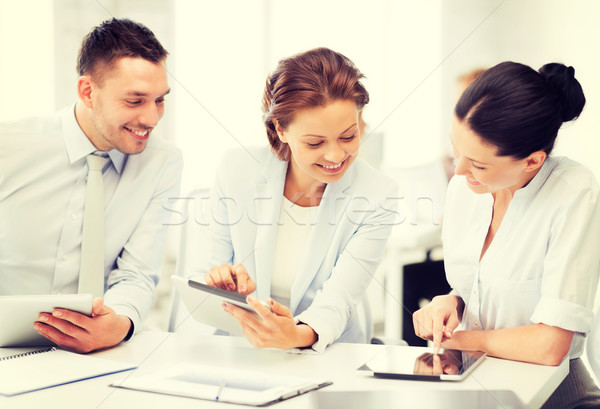 Stock photo: business team working with tablet pcs in office