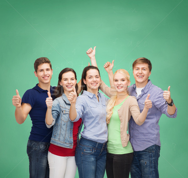 Stock photo: group of smiling students showing thumbs up