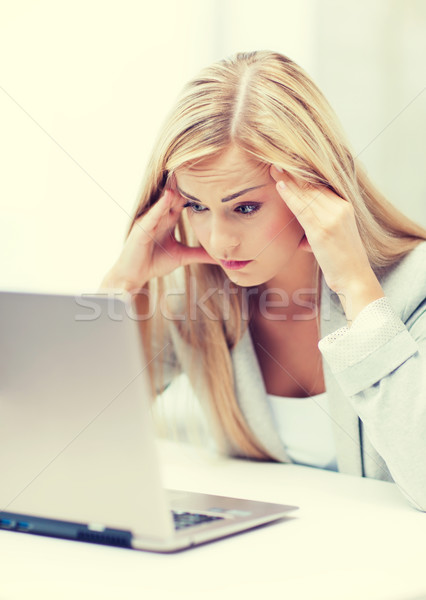 stressed woman with laptop Stock photo © dolgachov