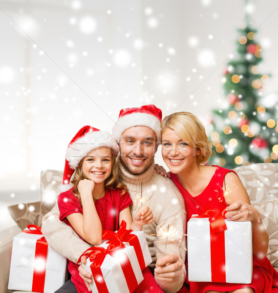 smiling family holding many gift boxes Stock photo © dolgachov