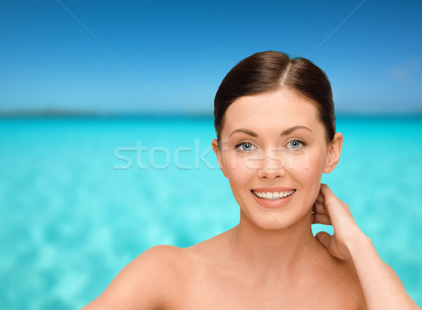 Stock photo: smiling young woman with bare shoulders