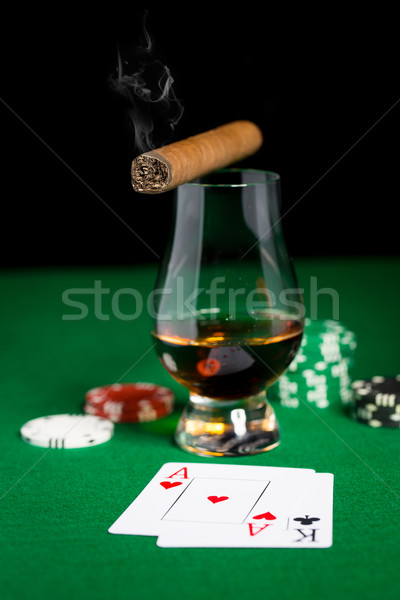 Közelkép sültkrumpli kártyák whisky szivar asztal Stock fotó © dolgachov