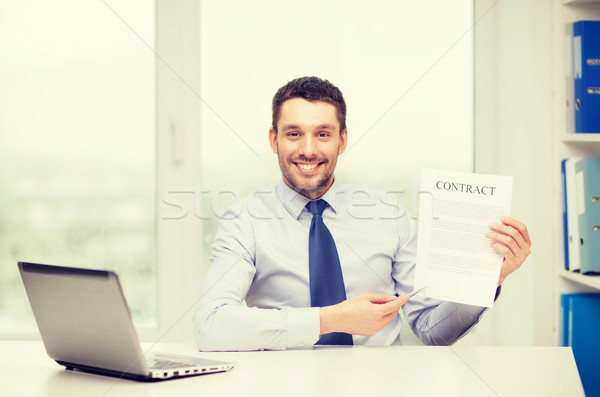 businessman with laptop and contract at office Stock photo © dolgachov